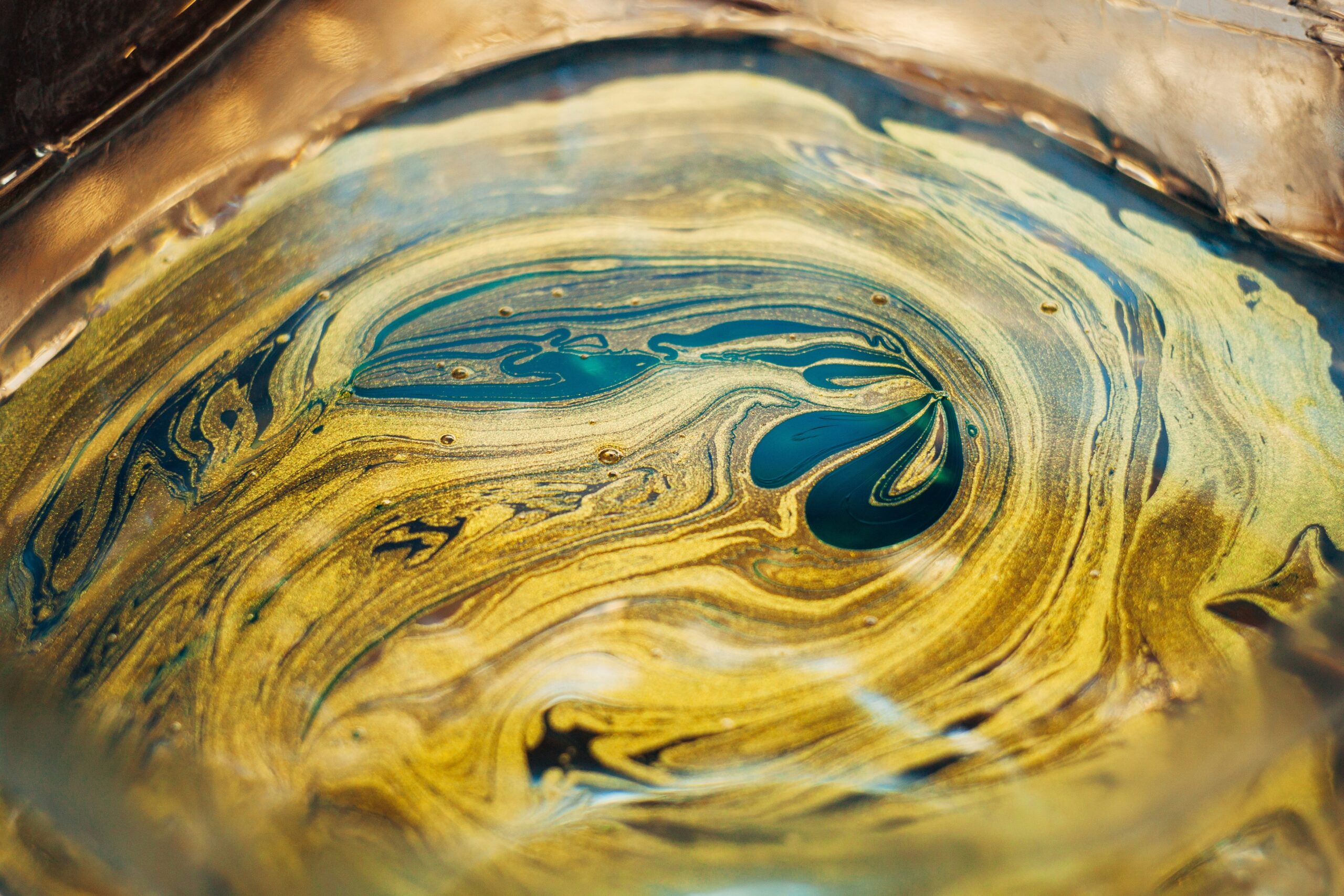 A golden retriever drinking a recovery shake from a stainless steel bowl